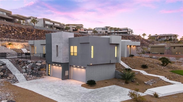 1455 Macdonald Ranch Dr, Henderson, NV 89012 - contemporary home featuring a garage, a residential view, and driveway
