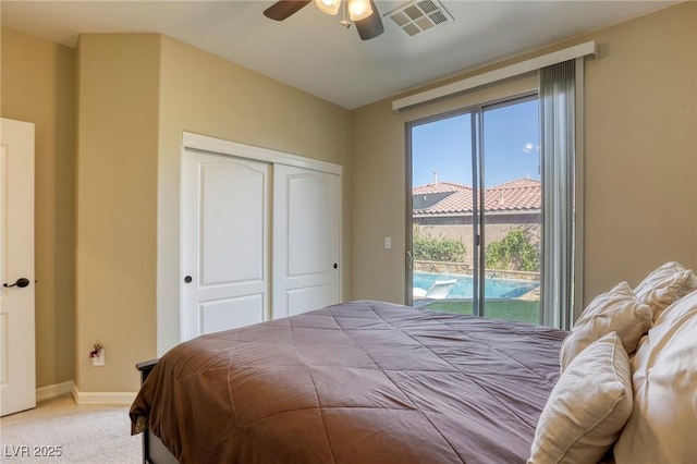 bedroom with light carpet, access to exterior, ceiling fan, and a closet