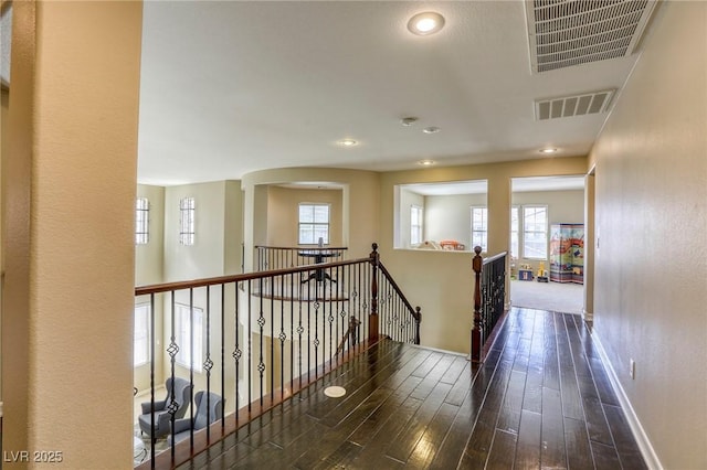 corridor featuring dark hardwood / wood-style floors