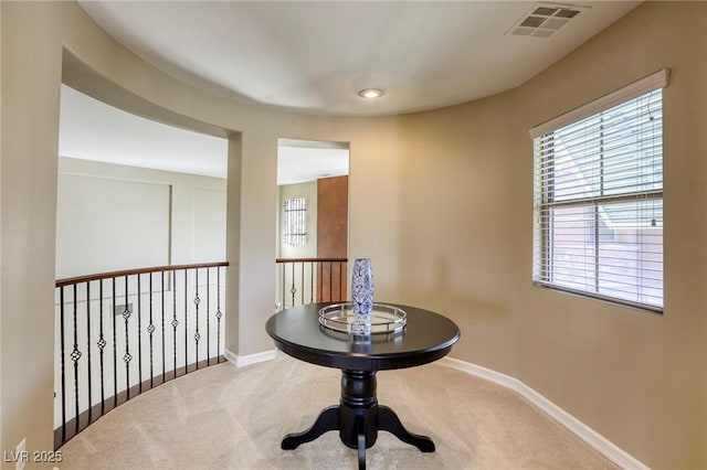 sitting room with carpet floors