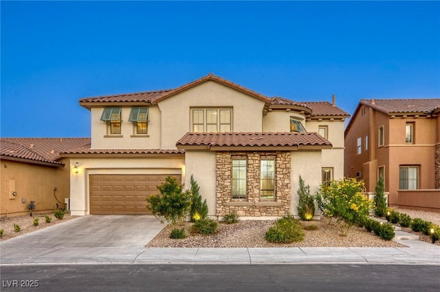 mediterranean / spanish-style house featuring a garage