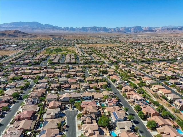 birds eye view of property featuring a mountain view