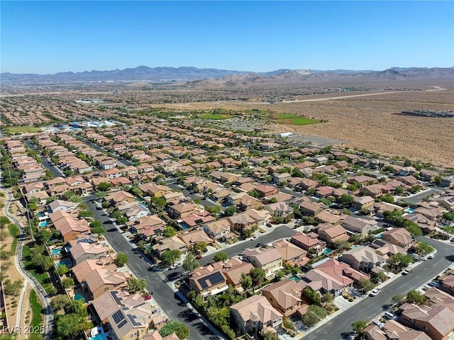 birds eye view of property featuring a mountain view