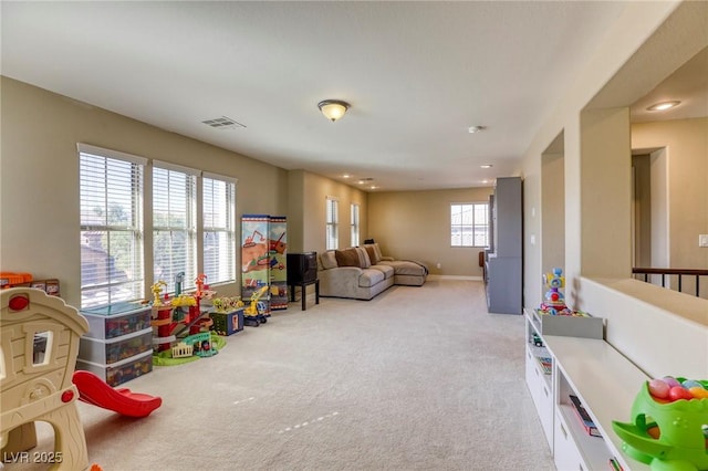 playroom featuring light colored carpet