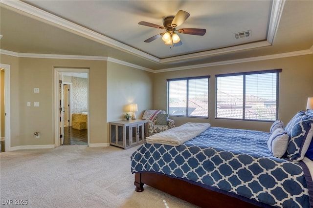 carpeted bedroom with a raised ceiling, crown molding, and ceiling fan