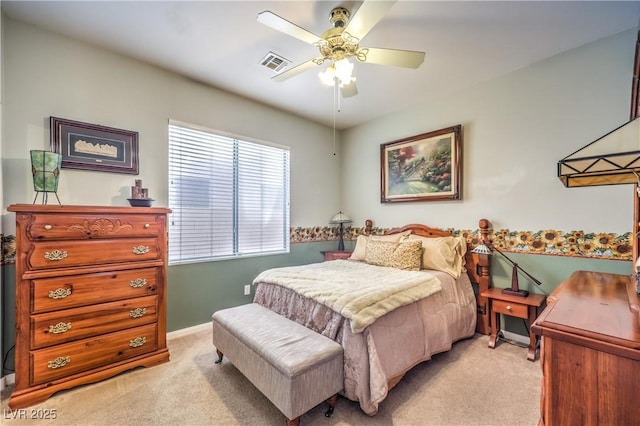 bedroom with light carpet, baseboards, visible vents, and ceiling fan