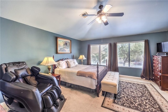 bedroom with light carpet, a ceiling fan, and lofted ceiling