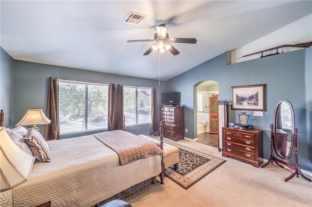 bedroom with arched walkways, carpet flooring, visible vents, baseboards, and vaulted ceiling