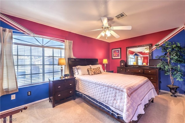 bedroom featuring light colored carpet, visible vents, and baseboards