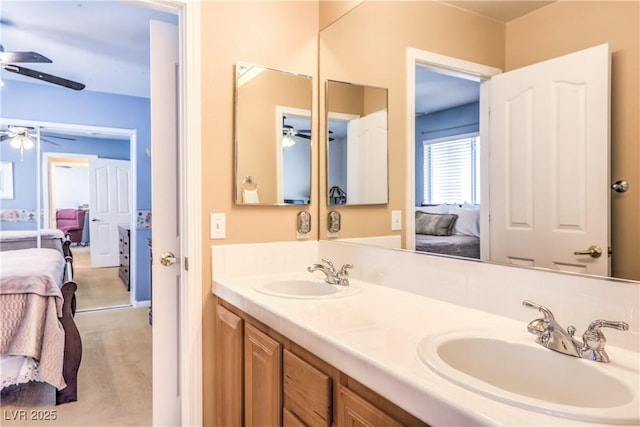 bathroom with a sink, ceiling fan, and connected bathroom