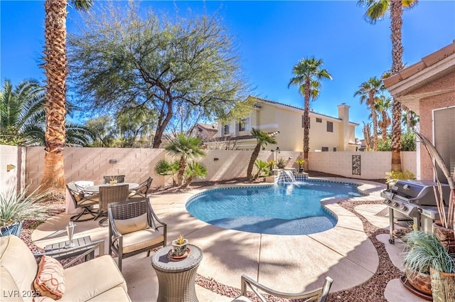 view of swimming pool featuring a fenced in pool, a patio area, a fenced backyard, and area for grilling