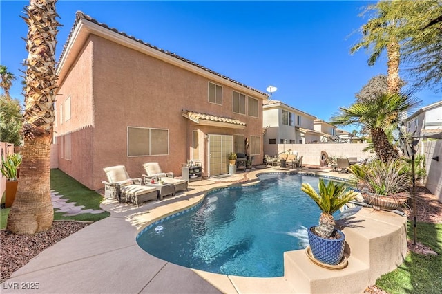 view of swimming pool featuring a patio, a fenced backyard, and a fenced in pool