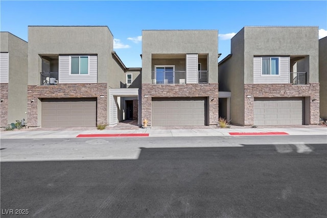 view of front of house with a balcony and a garage