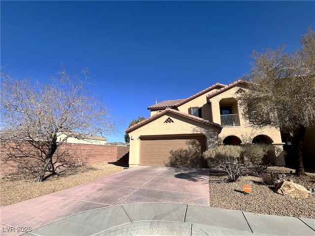 view of front of home featuring a garage and a balcony