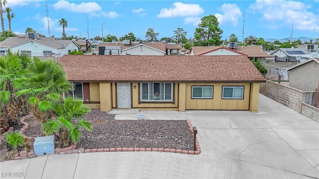 single story home featuring central AC unit