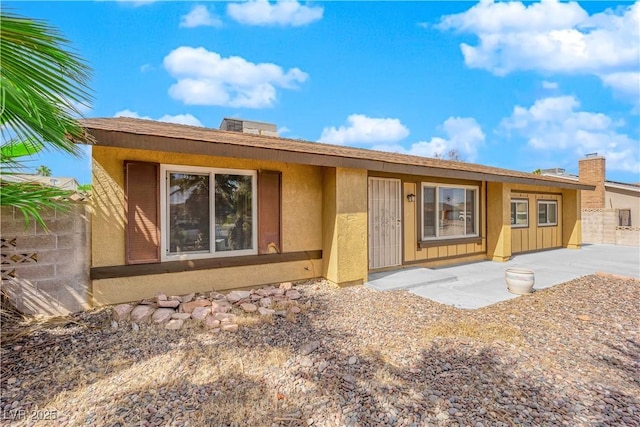 ranch-style house with a patio