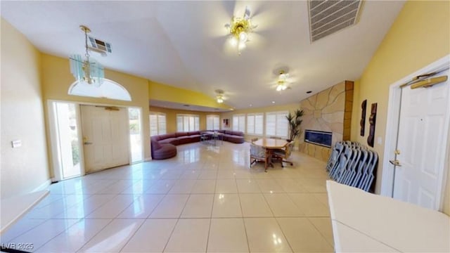 foyer featuring a tiled fireplace and tile patterned floors