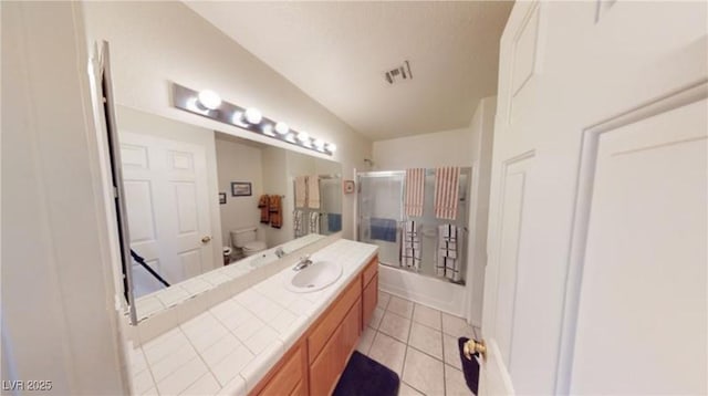 full bathroom featuring vanity, tile patterned floors, shower / bathtub combination, and toilet