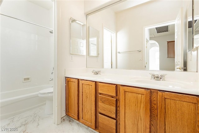 full bathroom with vanity, bathtub / shower combination, and toilet