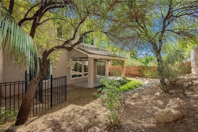 view of yard with a patio and a fenced backyard