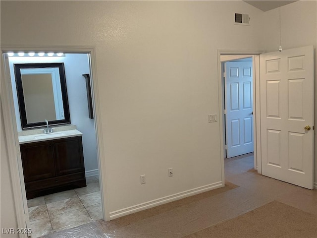 75 N Valle Verde Dr Unit 621, Henderson, NV 89074 - unfurnished room with a sink, light colored carpet, and baseboards