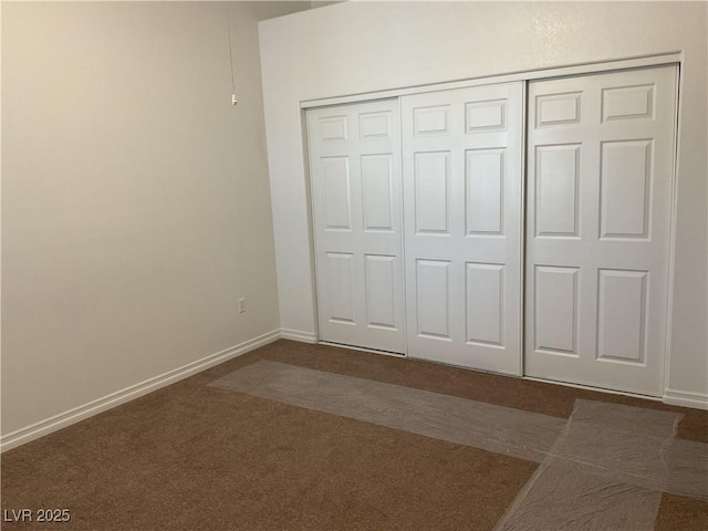 75 N Valle Verde Dr Unit 621, Henderson, NV 89074 - unfurnished bedroom with dark carpet, a closet, and baseboards