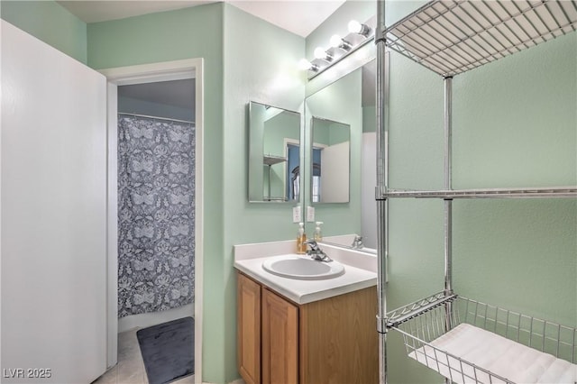 bathroom featuring vanity and a shower with shower curtain