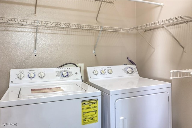 laundry area with washing machine and clothes dryer