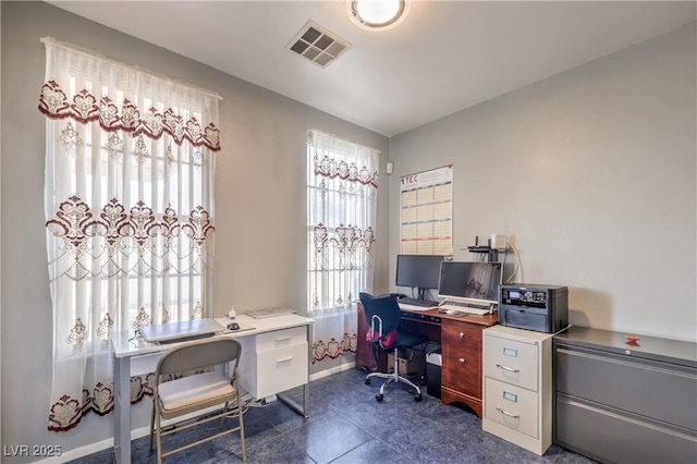 tiled office with a healthy amount of sunlight