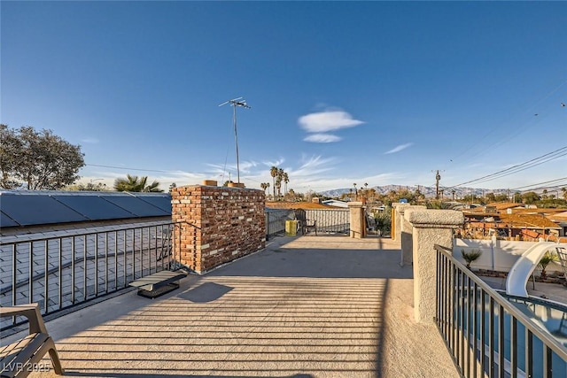 wooden terrace with a gate and fence