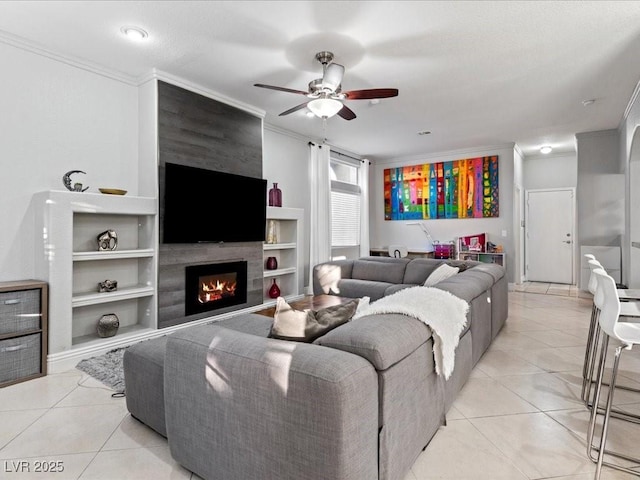 living room featuring ornamental molding, light tile patterned floors, and a fireplace