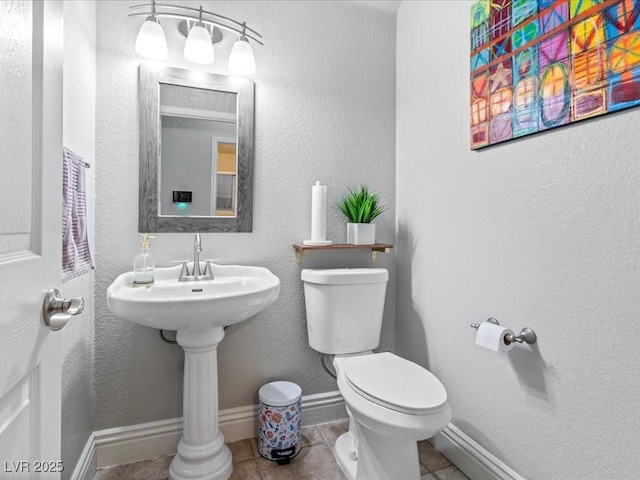 bathroom with tile patterned floors and toilet