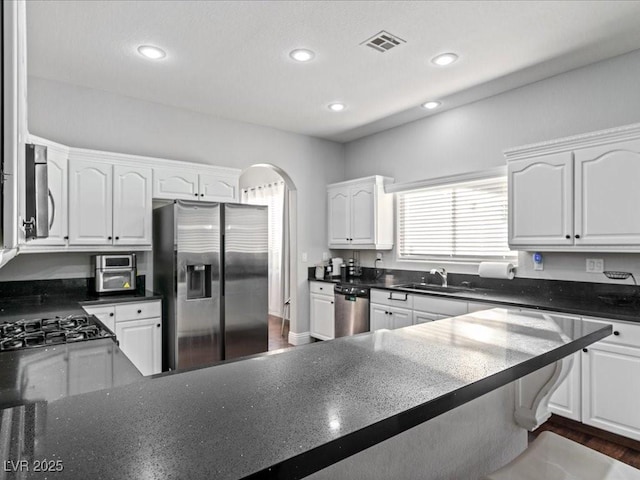 kitchen with white cabinetry, sink, and appliances with stainless steel finishes