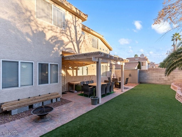 view of yard featuring a pergola, a patio area, and an outdoor fire pit