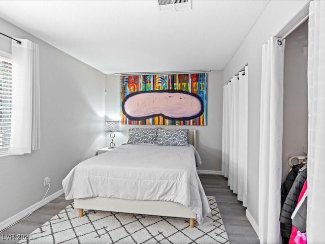 bedroom with wood-type flooring