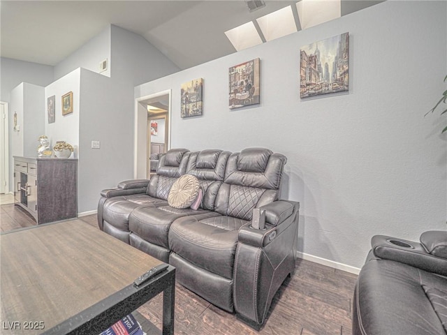 living room with lofted ceiling and dark hardwood / wood-style flooring