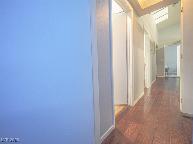 corridor with dark hardwood / wood-style floors