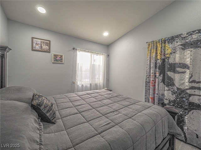 bedroom with lofted ceiling