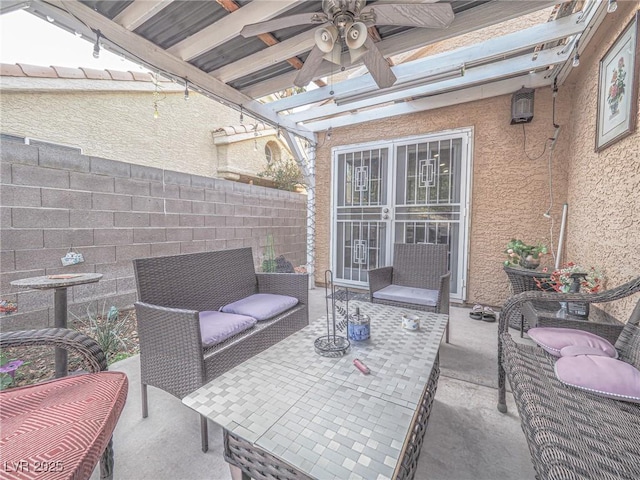 view of patio with an outdoor living space, ceiling fan, and a pergola