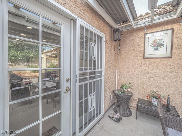 view of exterior entry featuring french doors