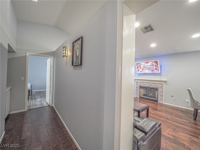 corridor featuring dark hardwood / wood-style floors