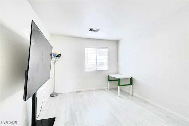 unfurnished room with light hardwood / wood-style flooring