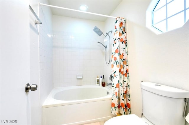 bathroom with shower / tub combo and toilet