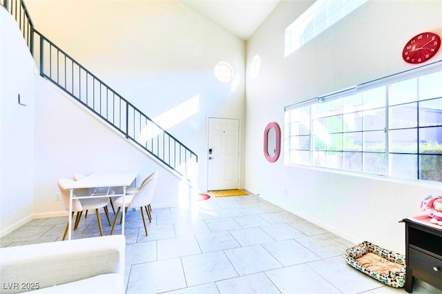 foyer featuring a high ceiling