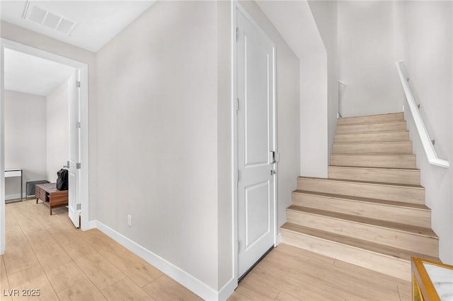 2503 Cracked Stone St, Henderson, NV 89044 - staircase featuring baseboards, visible vents, and wood finished floors