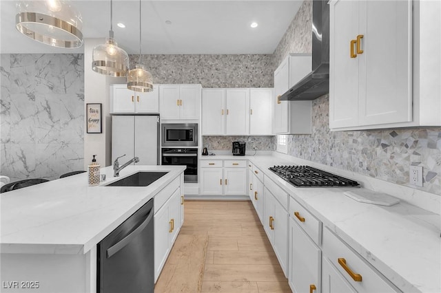 2503 Cracked Stone St, Henderson, NV 89044 - kitchen with wall chimney exhaust hood, white cabinetry, and stainless steel appliances