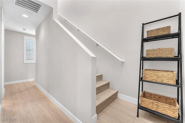 2503 Cracked Stone St, Henderson, NV 89044 - staircase with baseboards, visible vents, and wood finished floors