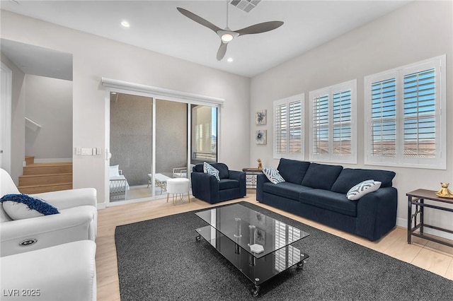 2503 Cracked Stone St, Henderson, NV 89044 - living area with baseboards, a ceiling fan, wood finished floors, stairs, and recessed lighting