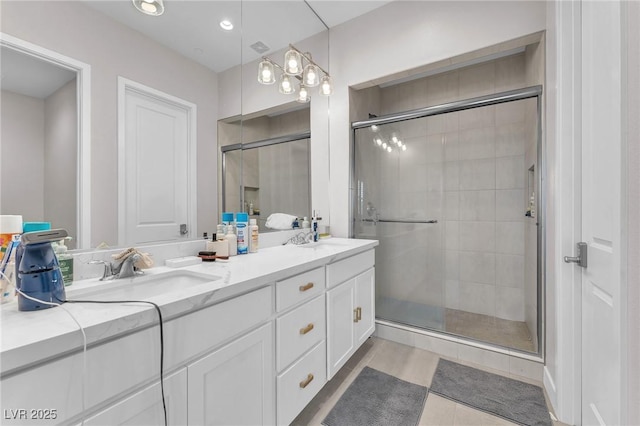 2503 Cracked Stone St, Henderson, NV 89044 - bathroom featuring double vanity, a stall shower, a sink, and recessed lighting