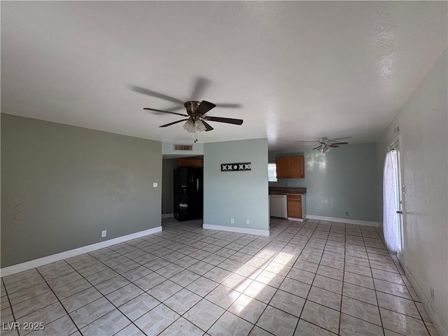 unfurnished living room featuring light tile patterned floors and ceiling fan